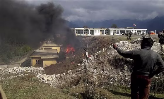 Smoke rises after an MI-17 helicopter crashed in the Buddhist pilgrimage town of Tawang, Arunachal Pradesh state, India, on Tuesday, April 19. The helicopter with 23 people on board was trying to land when it hit a wall and burst into flames killing at least 17 people, police said. 